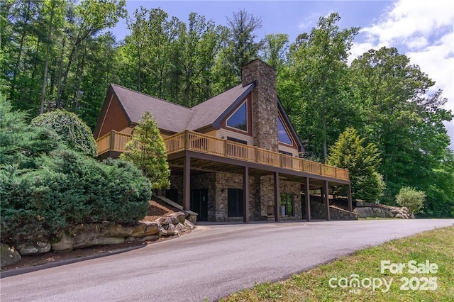 view of front of property featuring a wooden deck