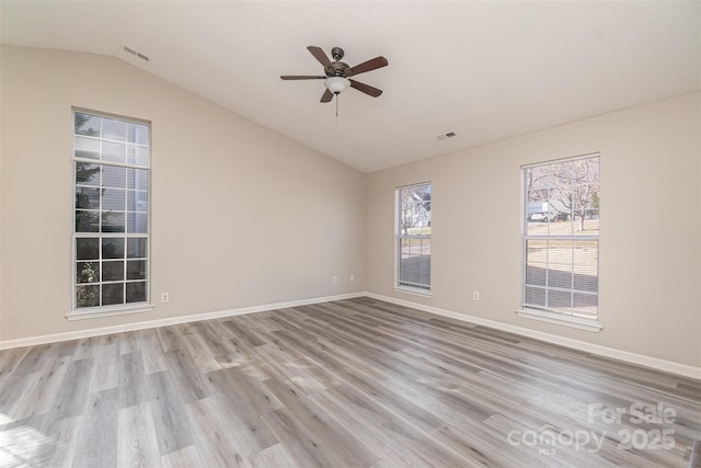 unfurnished room featuring ceiling fan, lofted ceiling, and light hardwood / wood-style floors