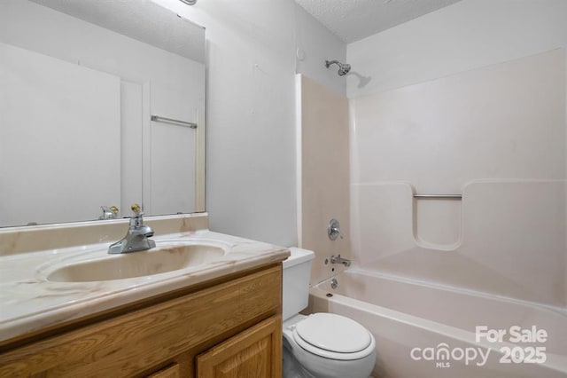 full bathroom with toilet, shower / bath combination, vanity, and a textured ceiling