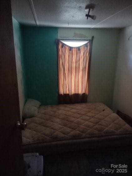 bedroom featuring a textured ceiling