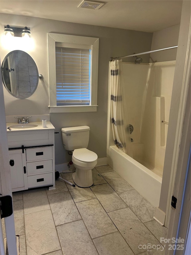 full bathroom with vanity, toilet, and shower / bath combo with shower curtain