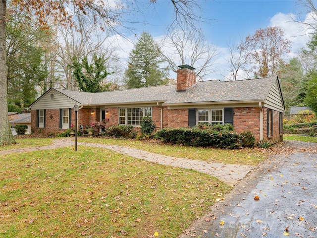 ranch-style house with a front yard