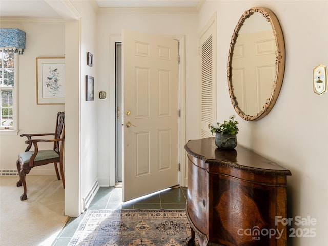 tiled foyer entrance with ornamental molding