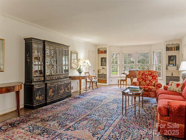 living room featuring hardwood / wood-style floors and built in shelves