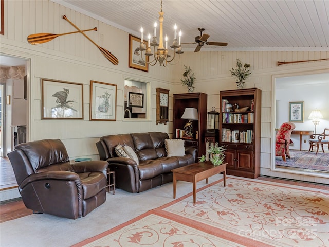 living room with wood ceiling, wood walls, carpet floors, lofted ceiling, and ceiling fan with notable chandelier