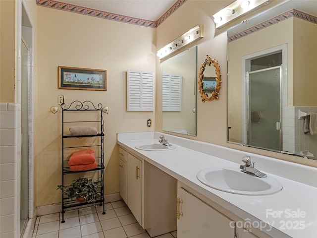 bathroom with vanity, an enclosed shower, and tile patterned flooring