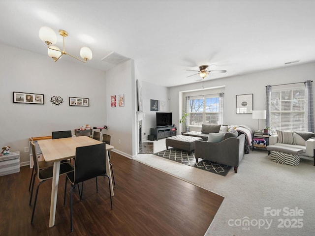 dining room with ceiling fan and dark hardwood / wood-style floors