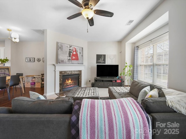 living room with ceiling fan and hardwood / wood-style floors