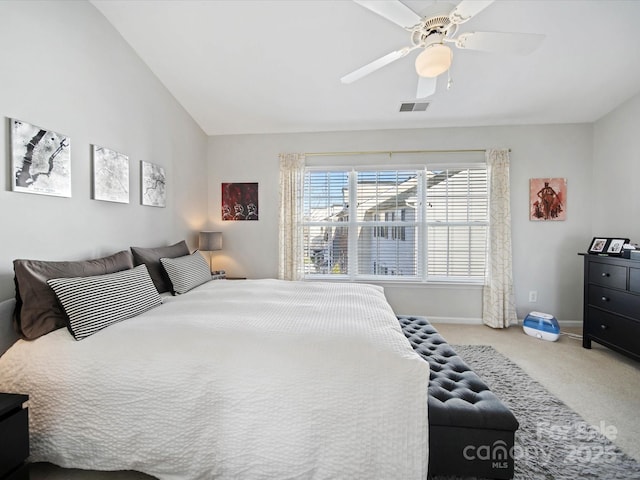 carpeted bedroom with ceiling fan and lofted ceiling