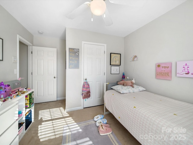 carpeted bedroom featuring ceiling fan