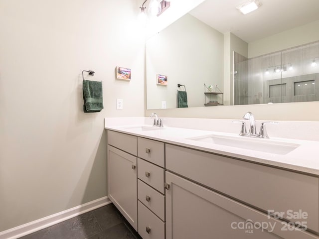 bathroom with vanity, a shower, and tile patterned floors