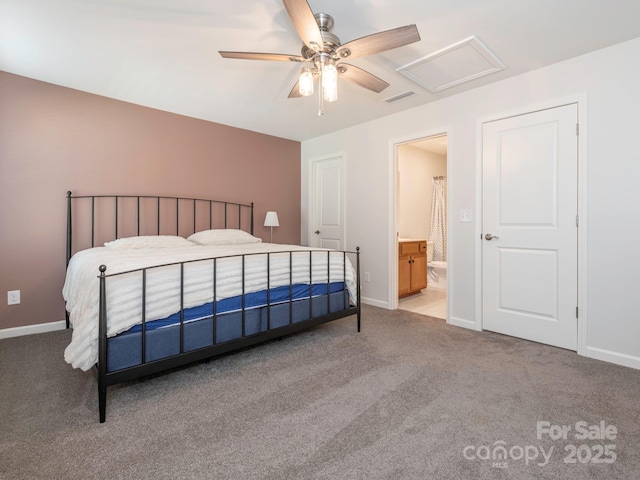 carpeted bedroom with ceiling fan and ensuite bathroom