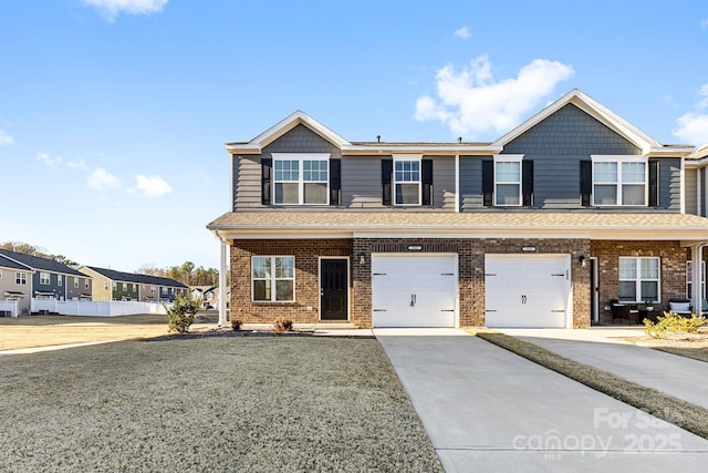 view of front of house with a front yard and a garage