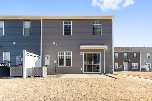 back of house with a patio and cooling unit