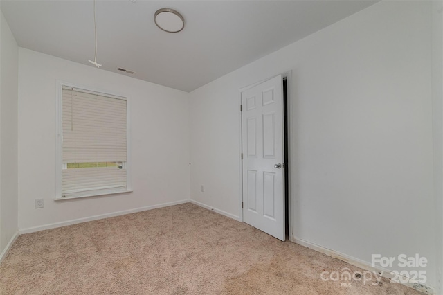 view of carpeted spare room