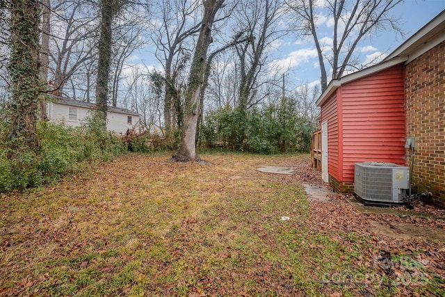 view of yard with central AC unit