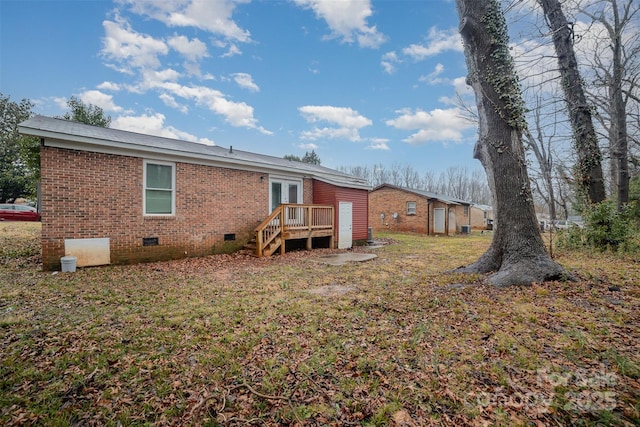 rear view of property with french doors