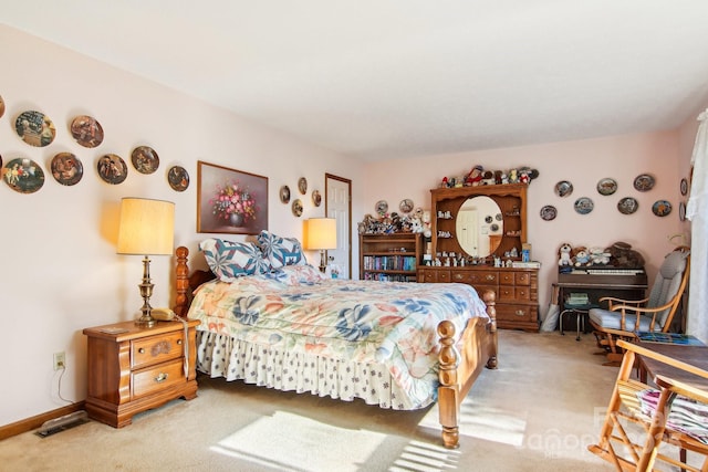 bedroom featuring light carpet