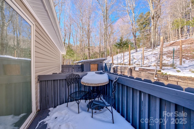 view of snow covered deck