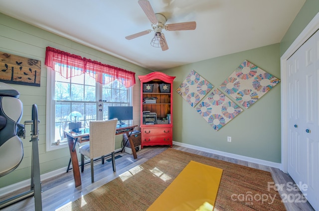 office space featuring plenty of natural light, ceiling fan, and hardwood / wood-style floors