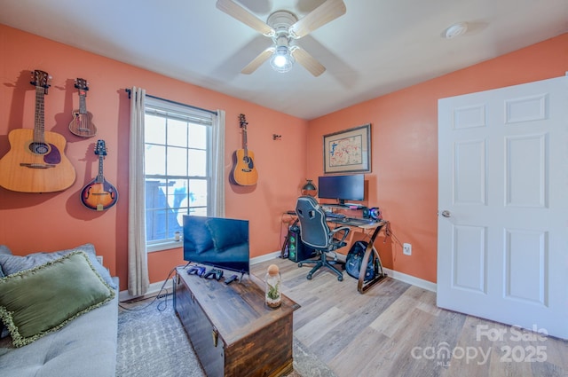 office featuring light wood-type flooring and ceiling fan