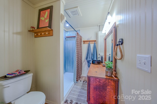 bathroom with wood-type flooring, vanity, curtained shower, and toilet