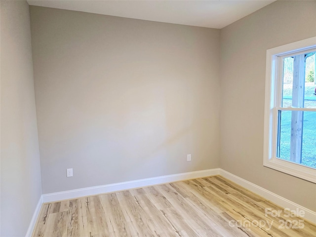 empty room with light hardwood / wood-style floors