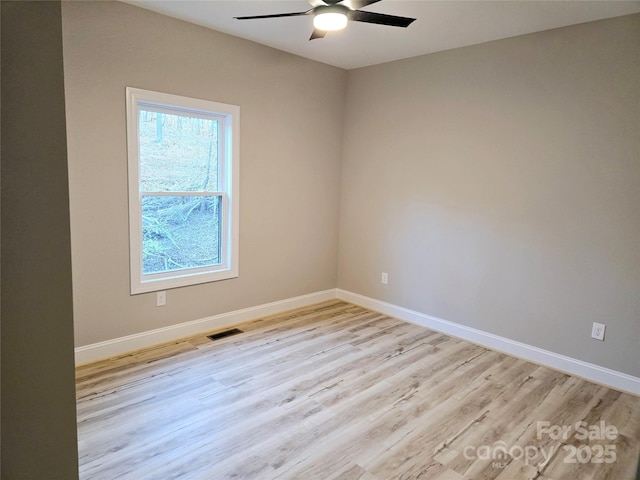 unfurnished room featuring ceiling fan and light hardwood / wood-style flooring