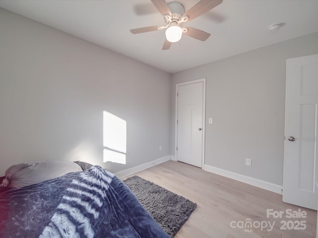 bedroom with light wood-type flooring and ceiling fan