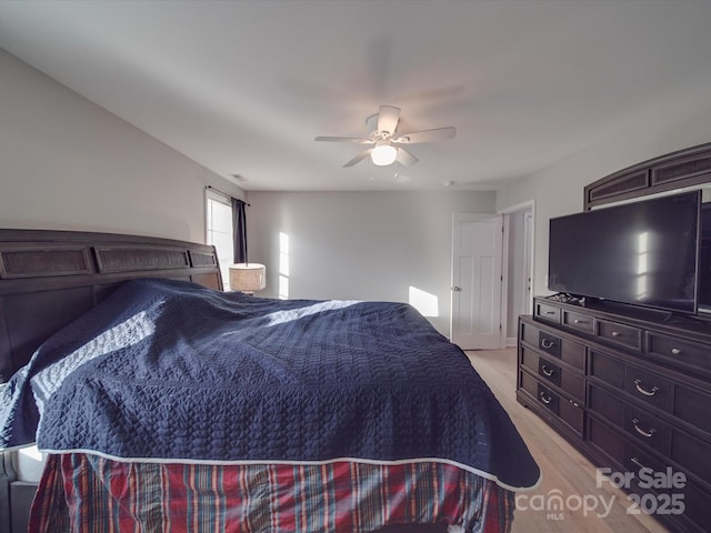 bedroom featuring light hardwood / wood-style flooring and ceiling fan