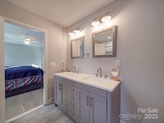 bathroom with ceiling fan and vanity