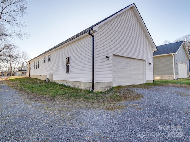 view of side of property with a garage