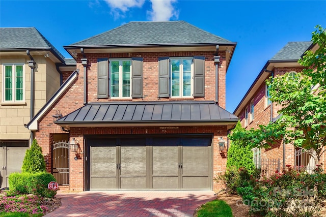 view of front of property with a garage