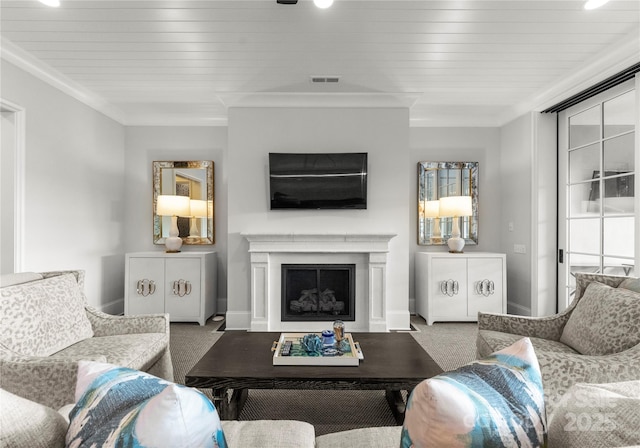 carpeted living room with crown molding