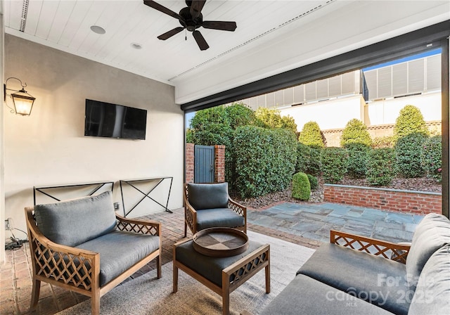 view of patio / terrace with ceiling fan and outdoor lounge area