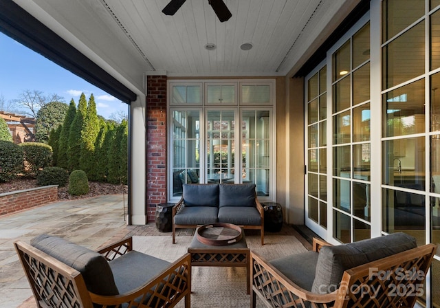 view of patio / terrace featuring ceiling fan and an outdoor living space