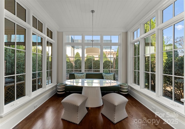 sunroom featuring wood ceiling