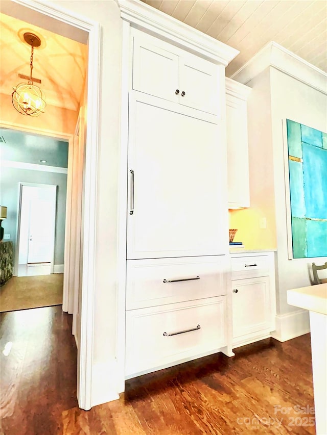 interior space featuring dark hardwood / wood-style flooring and crown molding