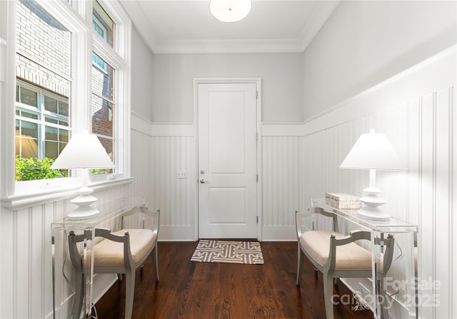 interior space featuring dark hardwood / wood-style floors and ornamental molding