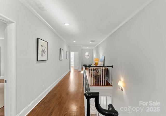 hall featuring crown molding and hardwood / wood-style floors