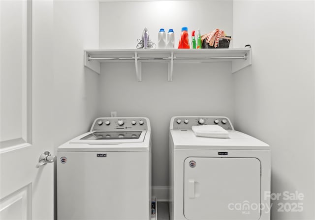 laundry room with washing machine and dryer