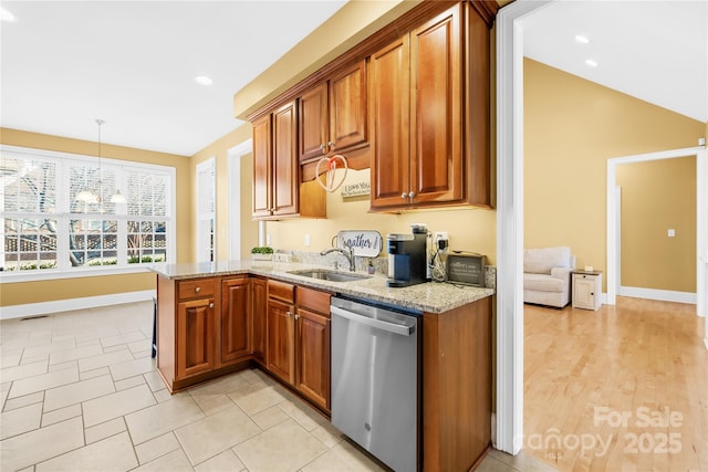 kitchen featuring sink, dishwasher, decorative light fixtures, kitchen peninsula, and light stone countertops