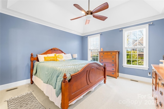 carpeted bedroom with ceiling fan, ornamental molding, and multiple windows