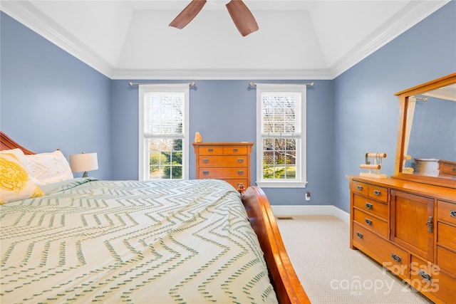 carpeted bedroom with crown molding, vaulted ceiling, and ceiling fan