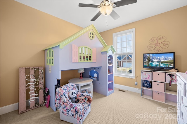 bedroom with light colored carpet and ceiling fan