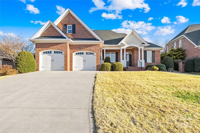 view of front of house with a front lawn and a garage