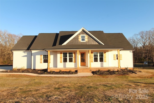 view of front of property with a front yard and a porch