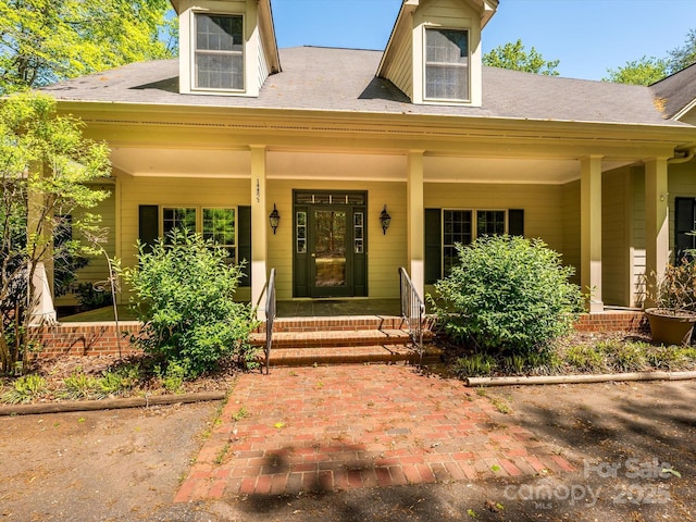 property entrance featuring covered porch