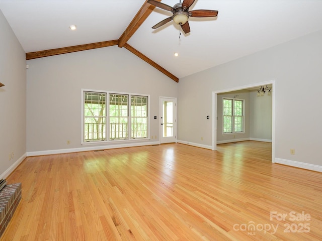 unfurnished living room featuring beam ceiling, light wood-style floors, and ceiling fan