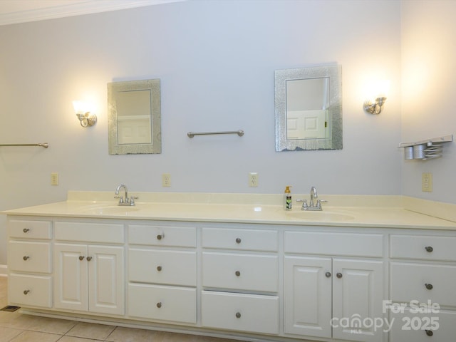full bathroom featuring double vanity, tile patterned flooring, and a sink